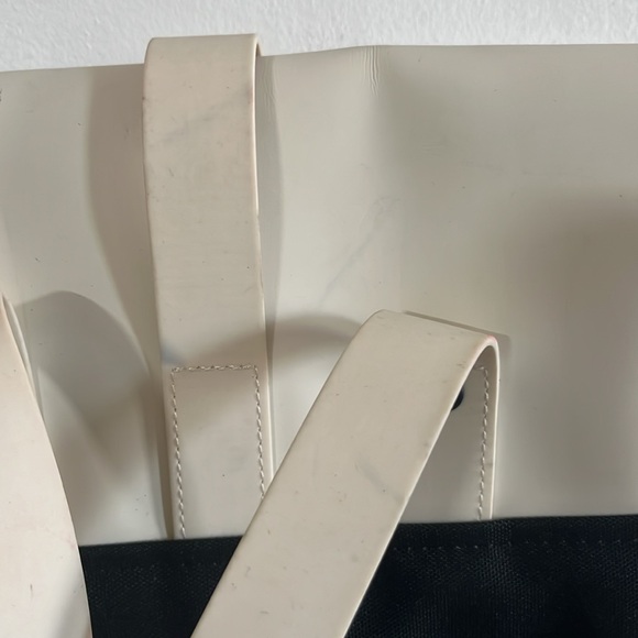 RAINS Shield Rucksack is a clean and functional backpack. Elegant Cream Backpack - Picture 8 of 11